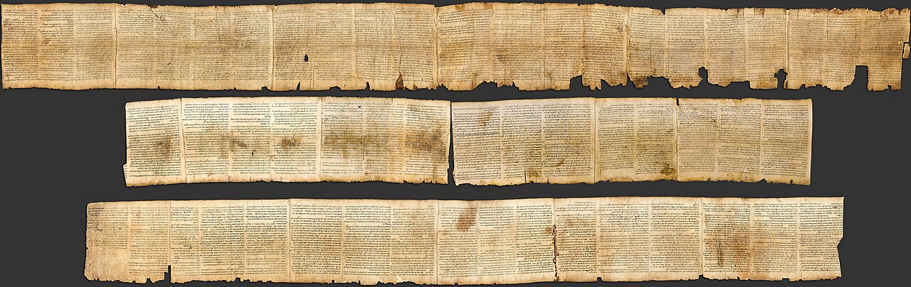 The Great Isaiah Scroll (1QIsaa) — long strips of aged parchment covered in dense columns of handwritten Hebrew text, shown unrolled in three registers.