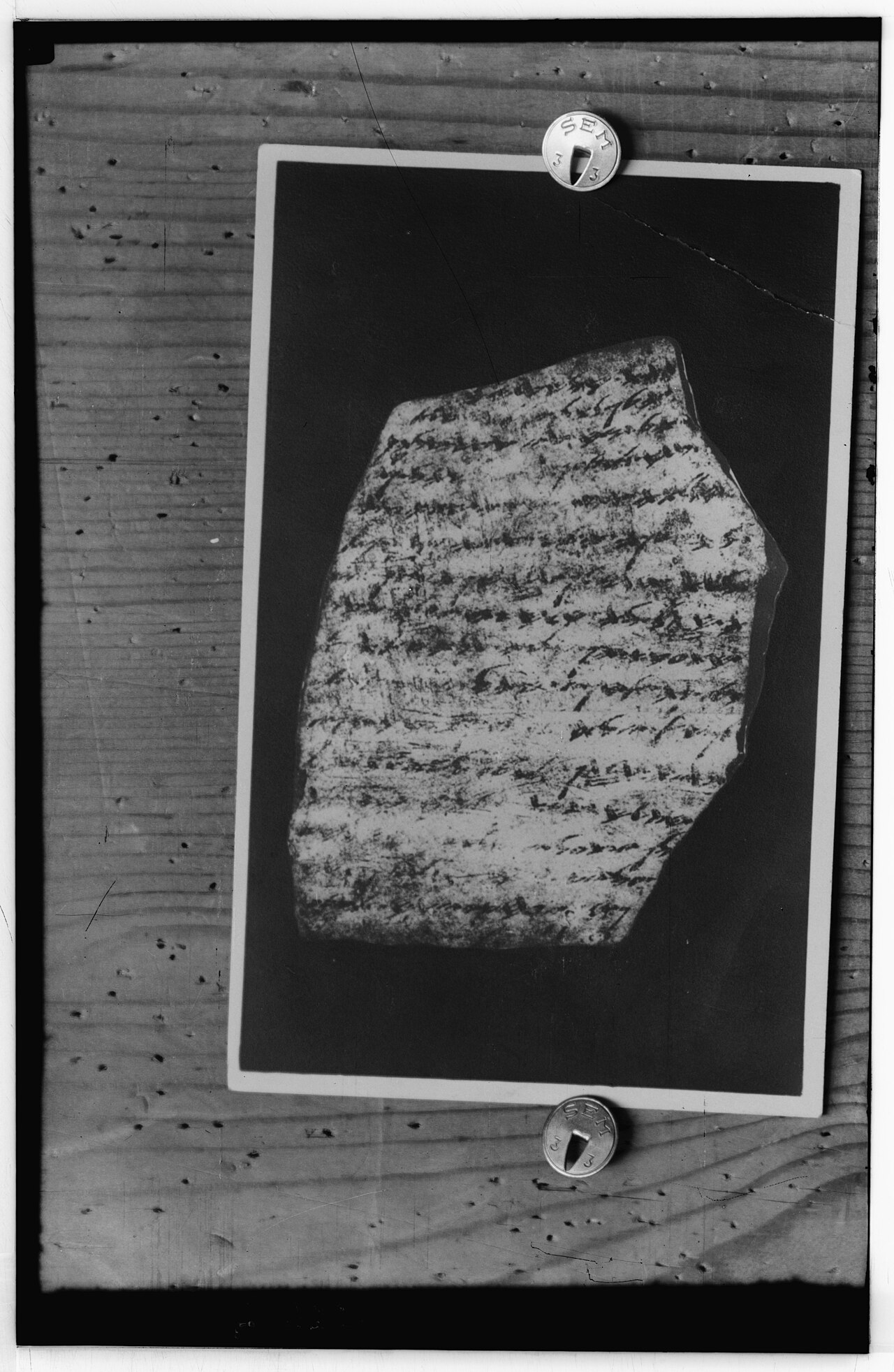 Lachish Letter number 3 — a broad potsherd covered in lines of ink-written paleo-Hebrew script — in a 1930s photograph from the Matson collection.
