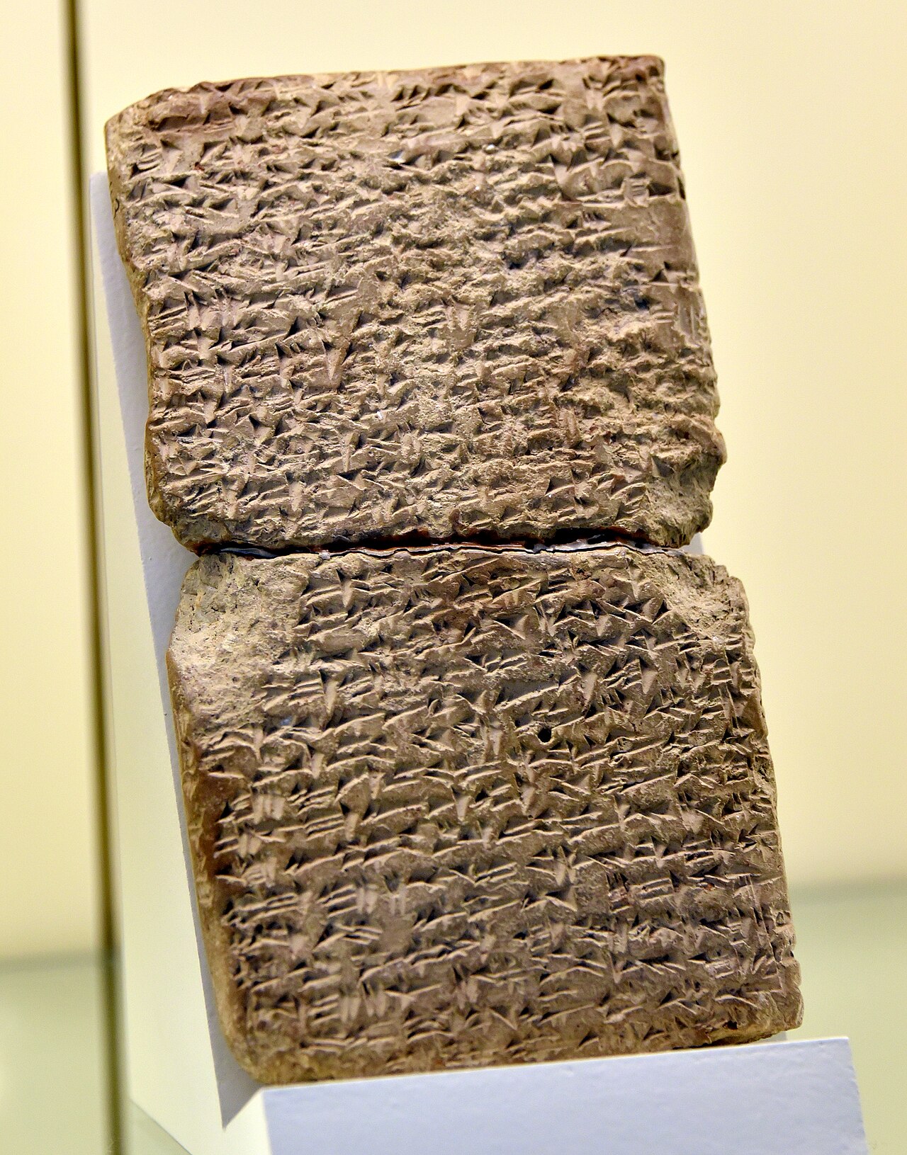An Amarna letter of Abdi-Heba of Jerusalem in the Vorderasiatisches Museum, Berlin — a pillow-shaped clay tablet covered edge to edge in fine cuneiform.
