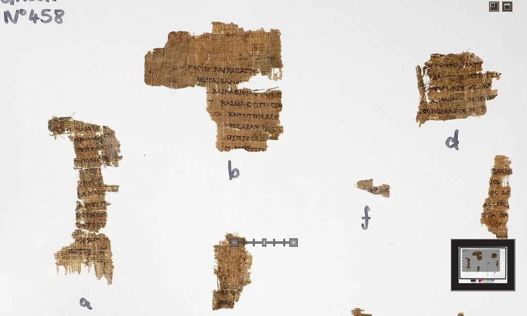The papyrus fragments of Rylands Greek Papyrus 458 — scraps of a Greek Deuteronomy roll of the second century BCE, mounted for display.