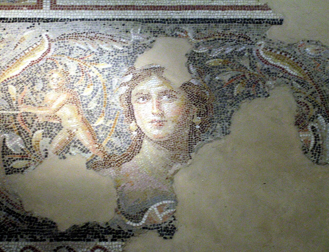 The "Mona Lisa of the Galilee" — the famous woman's face from the Dionysus mosaic floor of a third-century villa on the acropolis of Tzippori, rendered in tiny stone tesserae.