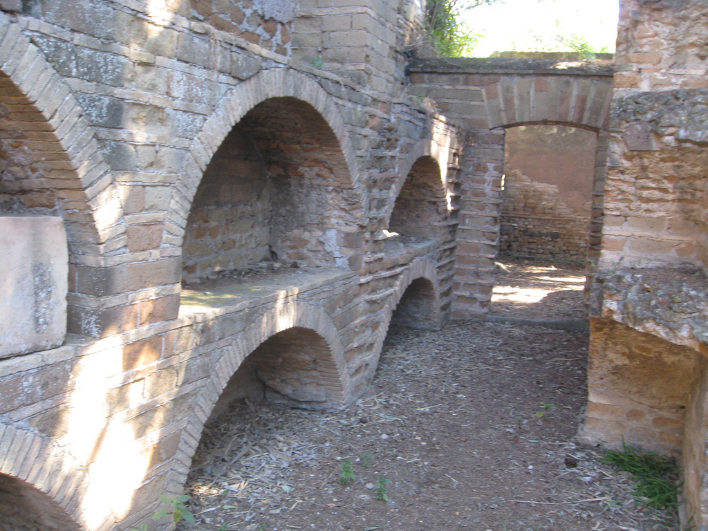 Brick-built arched burial niches in an open chamber at the Vigna Randanini Jewish catacomb complex off the Appian Way.
